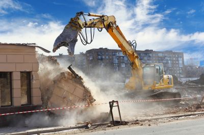 Excavator Demolishing a Building